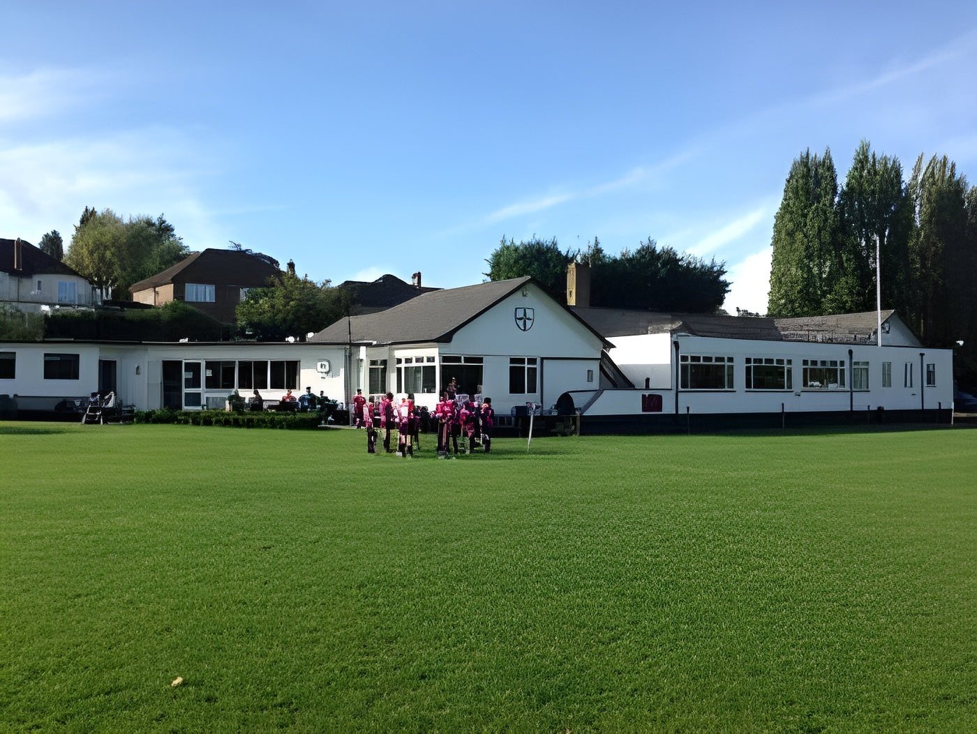 Local rugby team posing for a group photo outside Old Whits Clubhouse in South Croydon